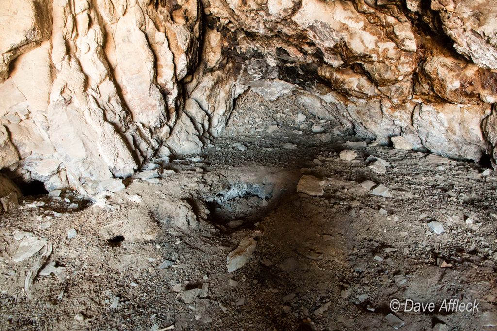 Pot hunters holes in floor of cave