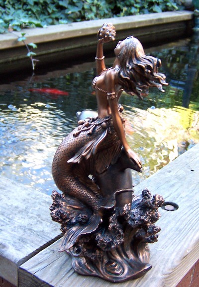 mermaid and dolphin statue
