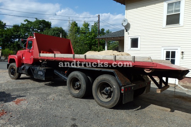 1985 R Model Mack Roll Off tandem-axle truck