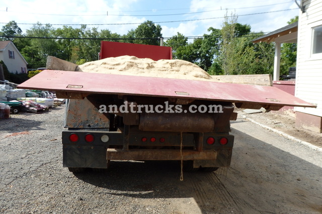 1985 R Model Mack Roll Off tandem-axle truck