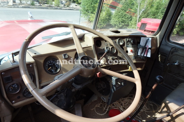 1985 R Model Mack Roll Off tandem-axle truck