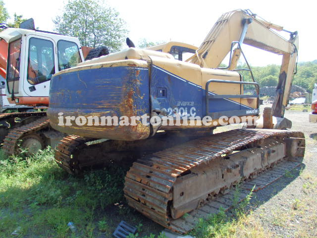 excavator with grapple