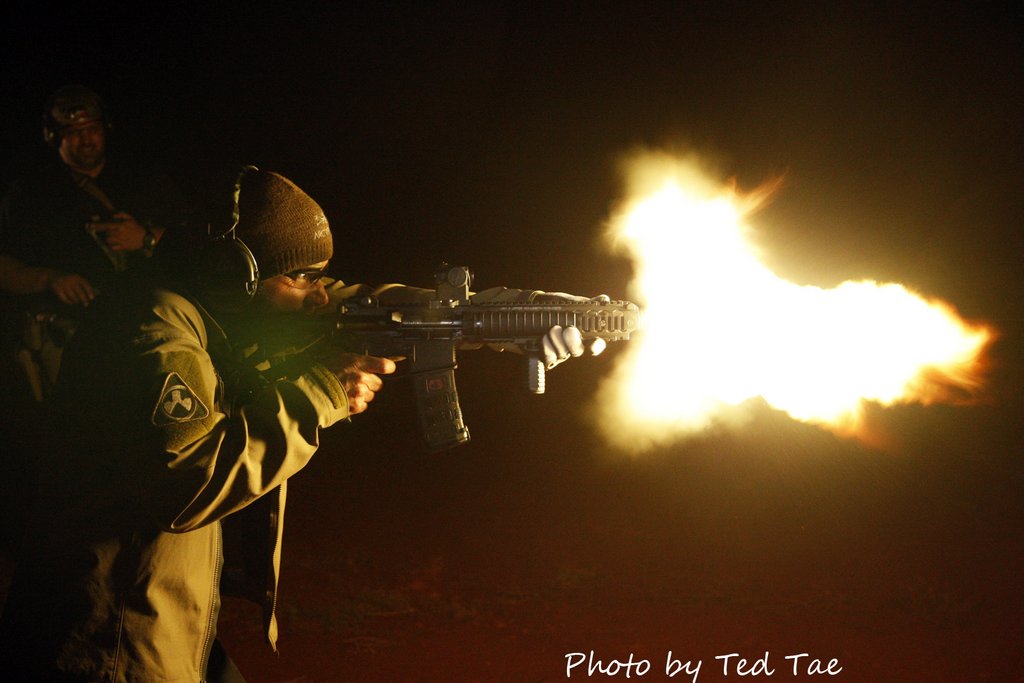 machine gun muzzle flashes