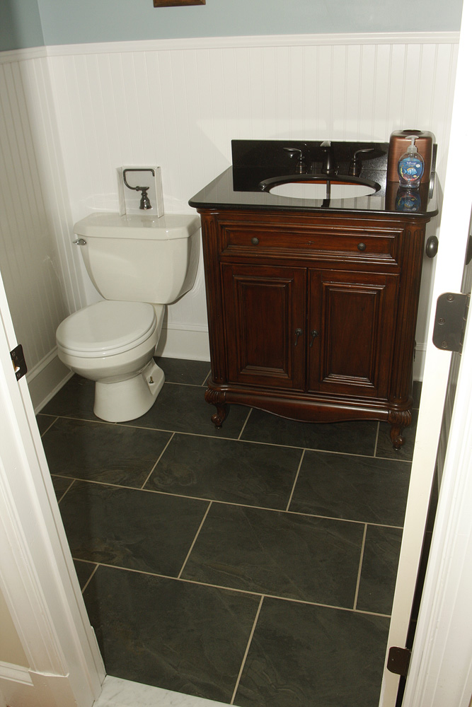 slate tile and new bathroom run the tile under the or butt them up to