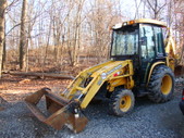 Backhoe John Deer 110 loaded