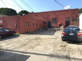 EXT. BEANS BAR - REAR PARKING LOT