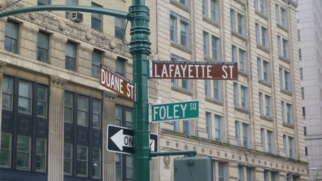 EXT. STREET-OUTSIDE THE FBI