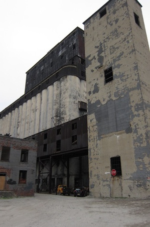 EXT. WHARF/INT. ABANDONED FISHERY BLDG